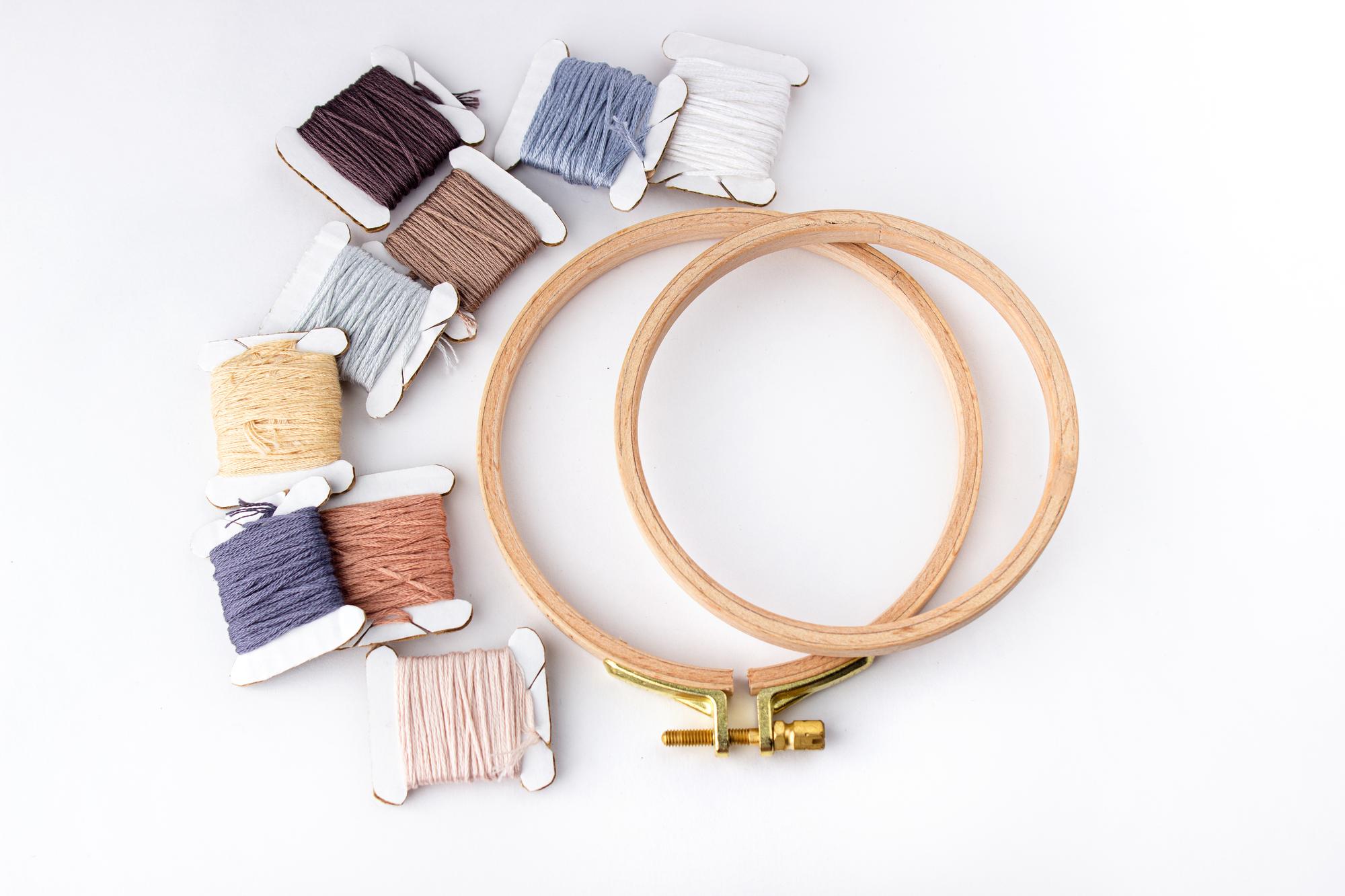 Assortment of embroidery threads and hoops